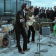 The Beatles performing their famous rooftop concert, as seen in Peter Jackson's new documentary.